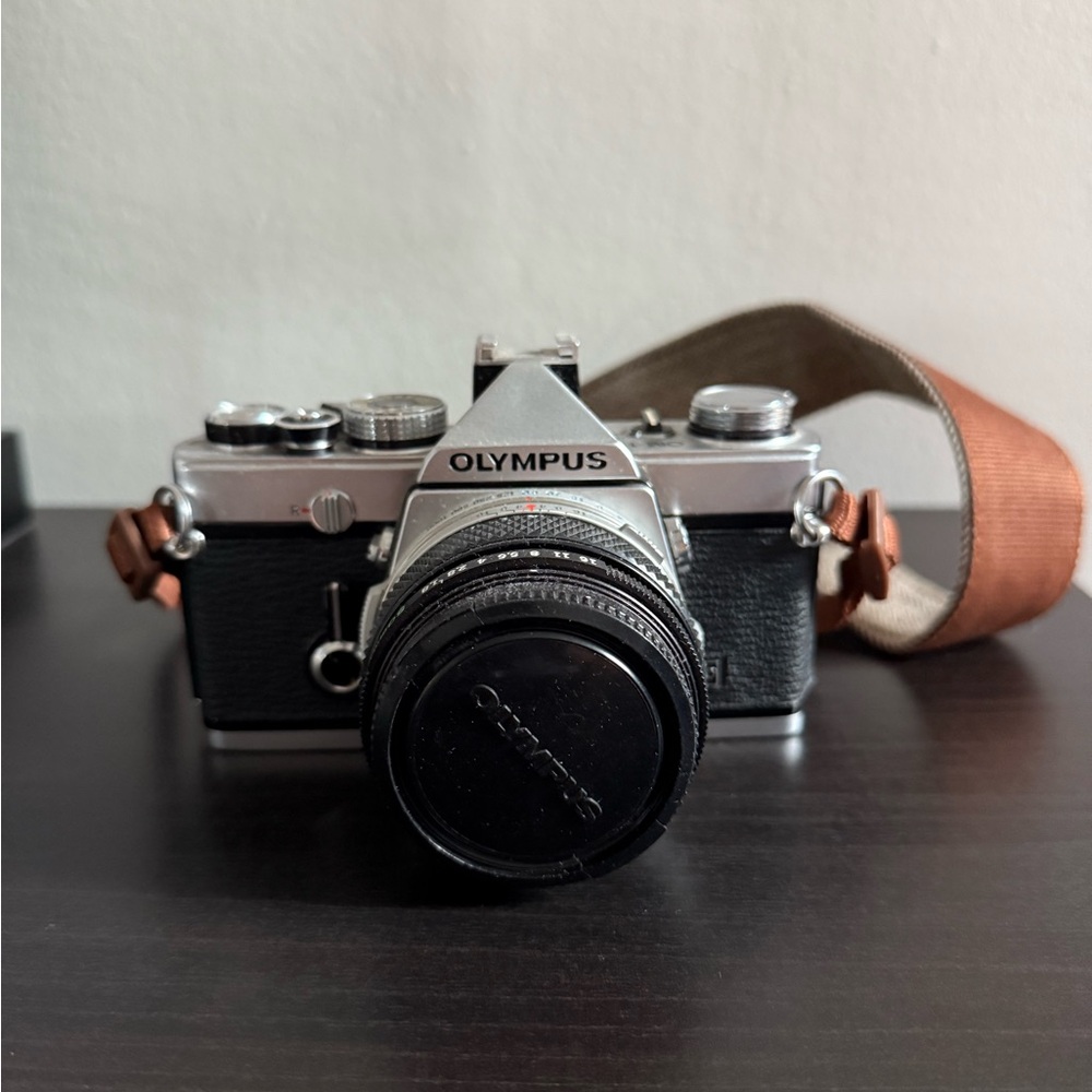 Olympus OM-1 Vintage Black and Silver Camera with Brown Strap